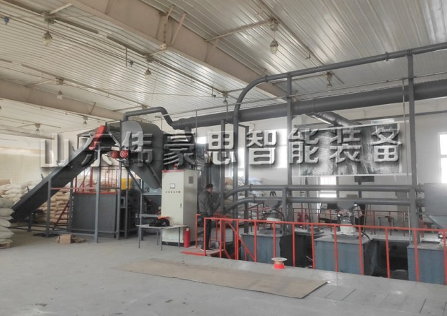 硅微粉自動拆包輸送線 自動破袋機工作現場